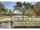 Picturesque neighborhood view of a scenic lake framed by mature trees and manicured landscaping at 826 Lake Evalyn Dr, Celebration, FL 34747