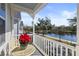 Inviting porch area with table set and relaxing lake view at 826 Lake Evalyn Dr, Celebration, FL 34747