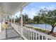 Relaxing porch scene with lake views and neighborhood charm at 826 Lake Evalyn Dr, Celebration, FL 34747