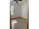 Well lit bedroom with a ceiling fan and wood flooring at 888 Berkley Rd, Auburndale, FL 33823