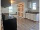 Bright kitchen with modern appliances, wood floors, and a large window at 888 Berkley Rd, Auburndale, FL 33823