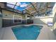 Enclosed private pool area with a safety fence and lounge chairs, perfect for relaxation at 8949 Candy Palm Rd, Kissimmee, FL 34747