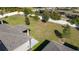 Large grassy backyard with a white fence and scattered trees at 899 Asterfield Ln, Deland, FL 32720