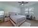 Inviting bedroom with large window, providing ample natural light, furnished with a cozy couch at 899 Asterfield Ln, Deland, FL 32720