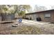 View of backyard featuring outdoor seating, a fire pit, grill, and trampoline on a large lot at 911 Kerry Blvd, Winter Haven, FL 33880