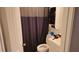 Bathroom featuring vanity and toilet in front of a gray shower curtain and towel rack at 911 Kerry Blvd, Winter Haven, FL 33880