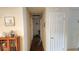 Hallway with hardwood floors leading to bedrooms and bathrooms at 911 Kerry Blvd, Winter Haven, FL 33880