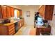 Kitchen with stained-wood cabinets and stainless appliances at 911 Kerry Blvd, Winter Haven, FL 33880