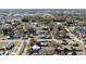 Expansive aerial view of a suburban neighborhood featuring tree-lined streets and diverse architectural home styles at 1418 Florida Ave, St Cloud, FL 34769