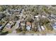 Aerial view showing the property's location within a tree-lined residential neighborhood at 1418 Florida Ave, St Cloud, FL 34769