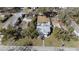 Overhead view of the property highlighting the house, yard, and surrounding foliage at 1418 Florida Ave, St Cloud, FL 34769