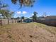 Expansive backyard with wood fence, open yard, and a storage shed at 1418 Florida Ave, St Cloud, FL 34769