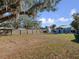 Expansive backyard with wood fence, open yard, and a storage shed at 1418 Florida Ave, St Cloud, FL 34769