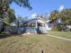 Charming single-story home featuring a quaint front porch and well-maintained lawn at 1418 Florida Ave, St Cloud, FL 34769