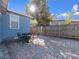 Brick patio featuring an outdoor dining area, a privacy fence, and mature landscaping at 1418 Florida Ave, St Cloud, FL 34769