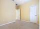 Neutral bedroom featuring carpeted floors and a walk-in closet at 100 Ventana Dr, Kissimmee, FL 34759