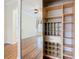 Organized closet with shelves, drawers, and mirrored doors at 100 Ventana Dr, Kissimmee, FL 34759