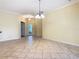 The dining room showcases an open layout with an ornate front door, tile floor, and decorative lighting at 100 Ventana Dr, Kissimmee, FL 34759