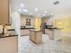 Spacious kitchen boasts an island sink and stainless steel appliances at 100 Ventana Dr, Kissimmee, FL 34759