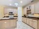 A bright kitchen is equipped with a kitchen island, modern appliances, and ample countertop space at 100 Ventana Dr, Kissimmee, FL 34759