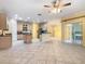 Open-concept kitchen features an island, stainless steel appliances, and ample cabinetry at 100 Ventana Dr, Kissimmee, FL 34759