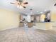 Spacious kitchen features a center island, tile floors, and plenty of natural light at 100 Ventana Dr, Kissimmee, FL 34759