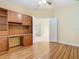 Office features built-in shelving, wood floors, and a neutral color palette, perfect for a home workspace at 100 Ventana Dr, Kissimmee, FL 34759