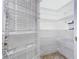Organized pantry with ample shelving to maximize storage space at 100 Ventana Dr, Kissimmee, FL 34759