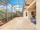 Covered patio with tile flooring, grill, and a view of the backyard at 100 Ventana Dr, Kissimmee, FL 34759