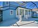 Lovely home showcasing a covered porch and screened-in pool at 1111 Oscar Sq, Celebration, FL 34747