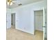 Bedroom with carpet, ceiling fan, and view of the en-suite closet at 1111 Oscar Sq, Celebration, FL 34747