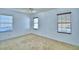 Bedroom with a ceiling fan, carpet, and three windows with blinds at 1111 Oscar Sq, Celebration, FL 34747