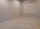 Neutral bedroom with carpeted floor, a large window, and ample natural light at 1111 Oscar Sq, Celebration, FL 34747
