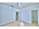Spacious bedroom with neutral walls and carpet, a ceiling fan, and natural lighting at 1111 Oscar Sq, Celebration, FL 34747