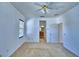 Bedroom featuring neutral carpeting, a ceiling fan, and an en-suite bathroom at 1111 Oscar Sq, Celebration, FL 34747