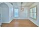 Well-lit dining area features wood floors, crown molding, and a modern pendant light fixture at 1111 Oscar Sq, Celebration, FL 34747