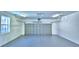 Spacious garage with a large door, window, and plenty of room for parking at 1111 Oscar Sq, Celebration, FL 34747
