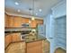 Kitchen with stainless steel appliances, center island, and a pantry at 1111 Oscar Sq, Celebration, FL 34747