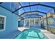 A screened-in pool boasts a covered porch area and a charming two-story light blue home at 1111 Oscar Sq, Celebration, FL 34747
