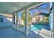 The inviting screened-in pool is surrounded by lush landscaping, creating a serene oasis at 1111 Oscar Sq, Celebration, FL 34747