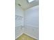 Empty walk-in closet features wire shelving for optimal storage at 1111 Oscar Sq, Celebration, FL 34747