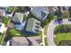 Aerial view of a home featuring a private pool and lush landscaping in a well-maintained neighborhood at 1111 Oscar Sq, Celebration, FL 34747