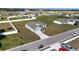 Drone shot of homes in a suburban neighborhood with spacious yards, driveways, and neatly paved streets at 1116 Caloosa Ridge Way, Babson Park, FL 33827