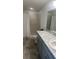 Bathroom features a granite countertop, and a tiled shower at 1116 Caloosa Ridge Way, Babson Park, FL 33827