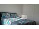 Comfortable bedroom with a bed that has decorative pillows and bedding and a double door closet at 1116 Caloosa Ridge Way, Babson Park, FL 33827