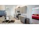 Well-equipped kitchen with stainless steel appliances and granite counters, flowing into the adjacent living space at 1116 Caloosa Ridge Way, Babson Park, FL 33827