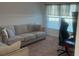 Comfortable home office features a plush sofa and dedicated workstation at 1116 Caloosa Ridge Way, Babson Park, FL 33827