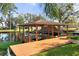 Well-maintained covered boat dock with multiple boat slips for convenient waterfront living at 11812 Lakeshore Dr, Clermont, FL 34711