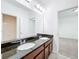Bathroom with a dual sink vanity and a view into another room at 12791 Westside Village Loop, Windermere, FL 34786