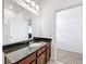 Bathroom with a granite vanity and a view into another room at 12791 Westside Village Loop, Windermere, FL 34786